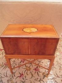 Living Room:  The BAKER English-style writing desk's lid opens for storage of stationery, pens, etc. or any other treasures you may wish to store.   It is 19" x 10" x 24" tall.