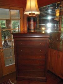 Library-First Floor:  This handsome 7-drawer chest (6 drawers + one hidden cornice drawer at top) is 36" wide x 20" deep x 53" tall.  It has a label that states "Fabrique au Canada," which means it was made in Canada.  On top is a 30" tall metal canister shape lamp with a painted crest on it.