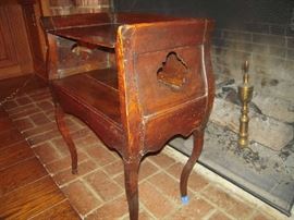 Library-First Floor:  This antique side table with quatrefoil cutouts on each side needs a little TLC but it is a wonderful piece! It measures 21" wide x 13" deep x 28" tall at the back.