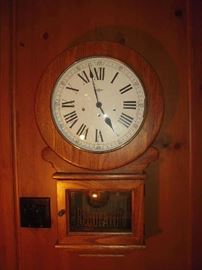 Library-First Floor:  The oak case REGULATOR wall clock is by HOWARD MILLER and measures 28" tall.
