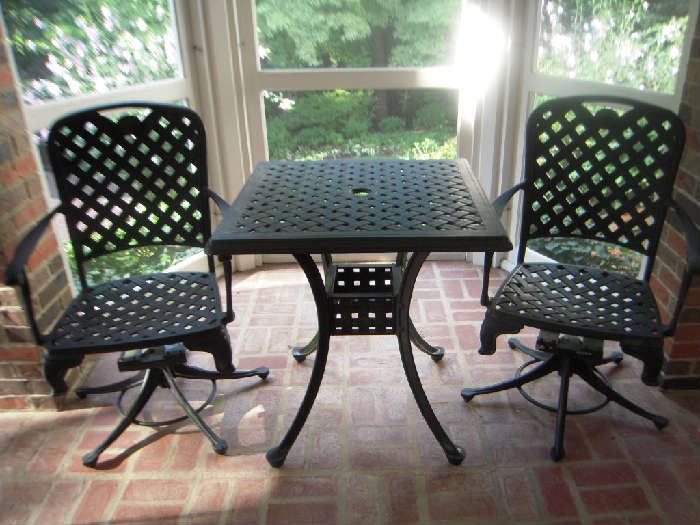 Sun Porch:  This black aluminum basket weave patio set was originally purchased at FORSHAW.  It includes two swivel chairs and a 28" square table that can accommodate an umbrella.