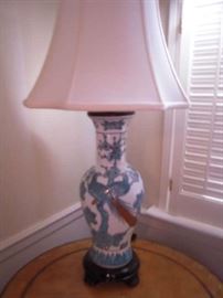 Bedroom #1-Upstairs:  A white/blue porcelain Chinoiserie lamp with bird motif is 30" tall and displayed on the MAITLAND-SMITH table.