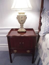 Bedroom #2-Upstairs:  This is one of the pair of  DREXEL night stands which has two doors and one drawer.  It measures 23" wide x 16" deep x 31" tall.  Also shown is one of two 32" tall cream/blue toile bird lamps with lion head rings on each side.  