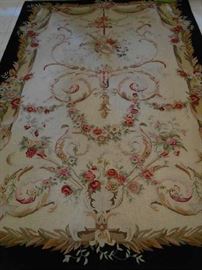 Sun Room-Atrium: The STARK floral rug with black border measures 6'  x  8'  11."