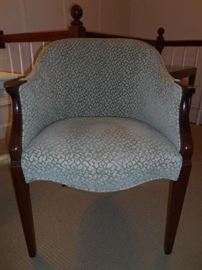 Apartment-Upstairs:  The continuous arm chair has a pale green/cream leopard-like pattern.