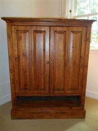 Apartment-Upstairs:  The pine cabinet has two doors and one open shelf.  It measures 41" wide x 25" deep x 50" tall.