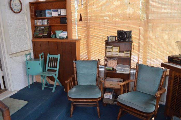 Of course 2 turquoise chairs, bookcase with games, 8 tracks