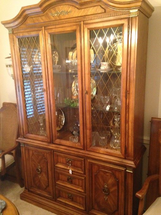 Matching china cabinet filled with treasures