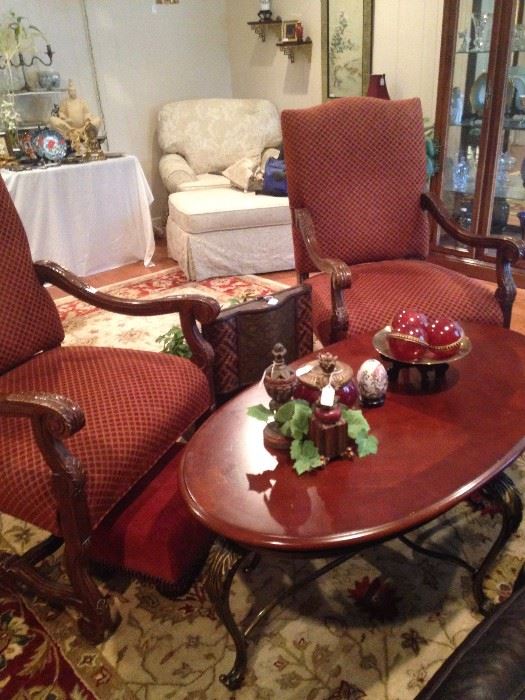 Two arm chairs; oval coffee table matches the two end tables.
