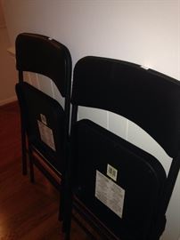 Two of six matching folding chairs
