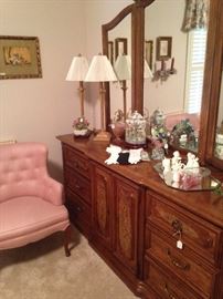 Triple dresser and pink bedroom chair