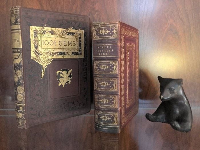 Antiquarian leather bound books, metal fighting bear