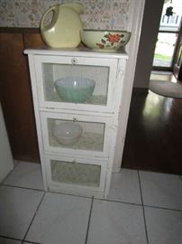 sweet cupboard with chicken wire front on doors