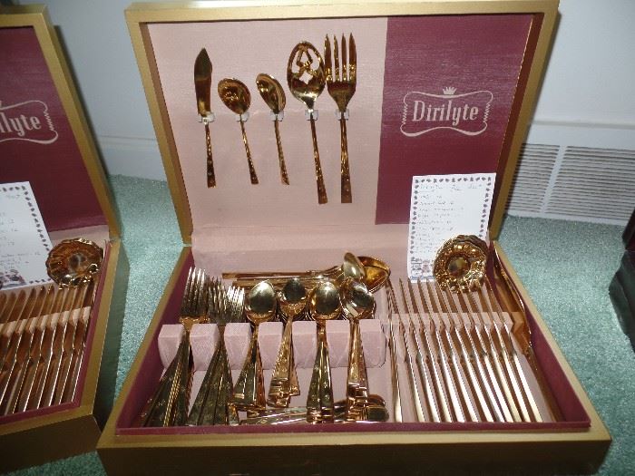 2 sets of gold flatware by Dirilyte