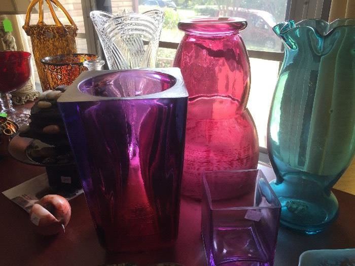 Large selection of colored glass vases 