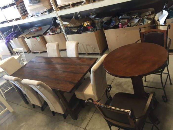 Dining tables and chairs. Former model home furnishings