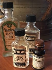 Vintage medicine bottles; Vaseline Hair Tonic, cod liver oil and more