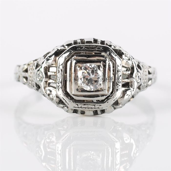 Late Edwardian 18K White Gold and Diamond Ring: An 18K white gold late Edwardian diamond ring set in a pierced octagonal frame.