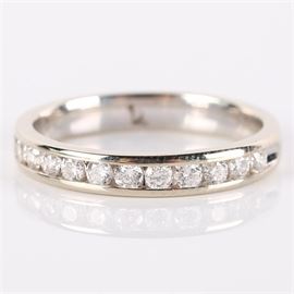 14K White Gold Channel Set Diamond Band: A 14K white gold and channel set diamond band.
