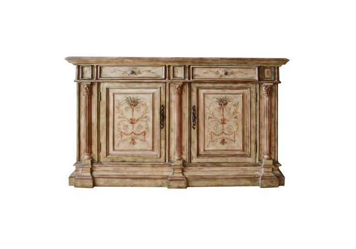 Hooker Furniture "Seven Seas" Credenza: A Hooker Furniture Seven Seas credenza. This French Provincial credenza in a distressed off white finish features two drawers to the center, with embossed hardware knob pulls and double cabinet doors to the center; with ornate elongated hardware. This credenza features painted floral, botanical and garland motifs to the top, drawers, and doors in additional hues of pink, olive green and brown.