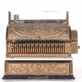 Antique National Cash Register: An antique National cash register. The cabinet has an ornate design with a marble top to the drawer, and a wooden divided cash drawer. Round tab keys are marked “Paid Out” and with dollar amounts for $1 through $6 and then “95, 90, 85…5” and “No Sale”. The front of the drawer is marked “National”, and a metal tag with the serial number “1326717” and the model number “347” is affixed to the surface. Small windows are present for “Customer Counter – Paid Out – No Sale” and “Dollars – Cents”. The item is also marked “National” to the backing.