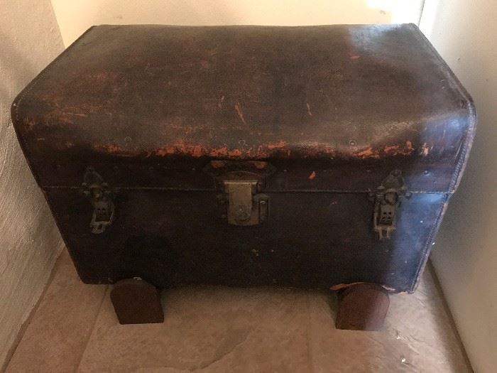 Leather steamer trunk with original hardware, handles and chromo lithographs inside