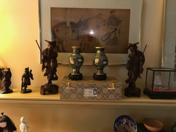 Lots of Oriental items.  Carved wooden figures, framed artwork with chop marks, cloisonné vases in their original box.