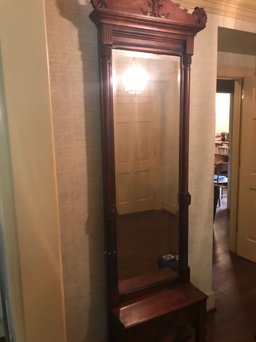 Antique mirrored hall piece with seat.