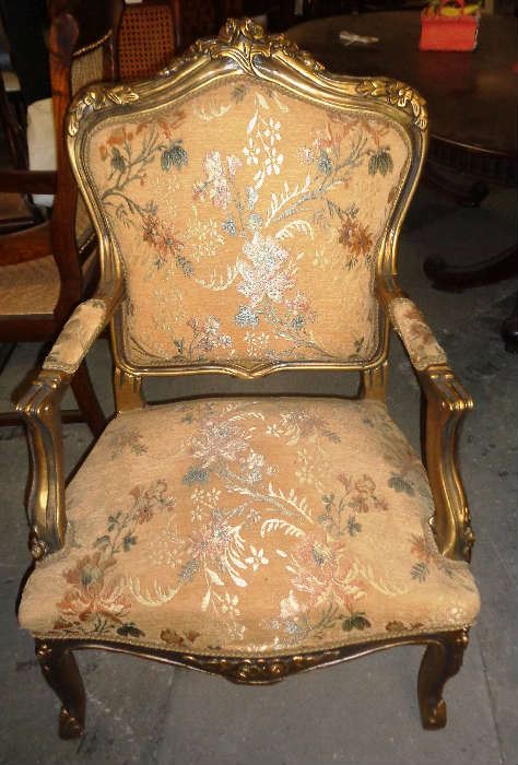 Pretty flora accent arm chair with solid mahogany frame finished in gold. 