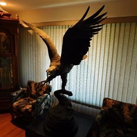 eagle statue by J. Moigniel that is 5' 10" tall and has a wing span of over 5 feet