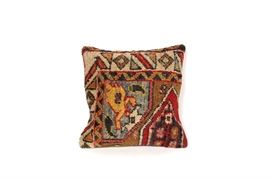 Kilim Throw Pillow: A Kilim throw pillow. This pillow is composed of a part of a hand woven old Kilim area rug. It has a 100% wool front and a 100% cotton backing. It is marked made in Turkey.