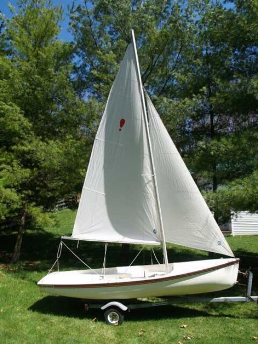 This photo is NOT the sailboat in this estate. It is used here to show boat with sails. 
Estate boat is identical except for color if hull. Estate  boat is RED! See next photo.