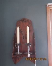Decorative, carved, wooden shelves; candle stick holders