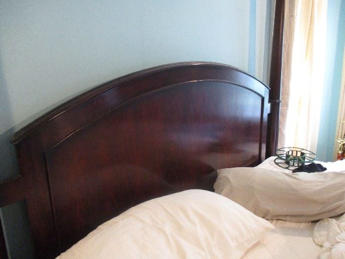 Henredon solid cherry four-poster bed.  Queen-sized. Includes mattress and all bedding.