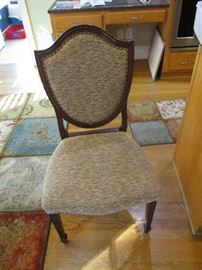 Four upholstered side chairs.