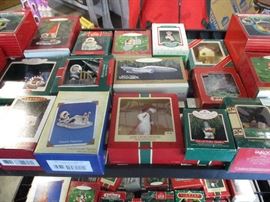Two shelves of Hallmark ornaments