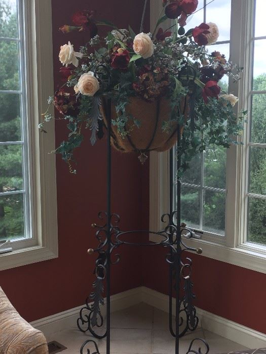 Very unique and ornate iron planter. Stands almost 6 ft
