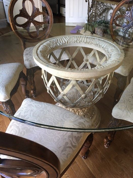 Gorgeous dining set with 5 sturdy wood carved chairs with 60" round glass top on a decorative stone and iron base