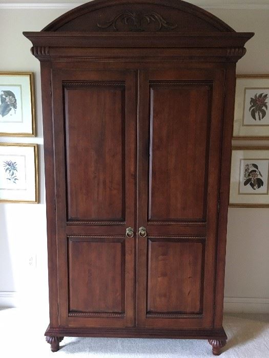 Armoire piece from bedroom set. Interior has shelving, hanging clothes bar and opening for TV.