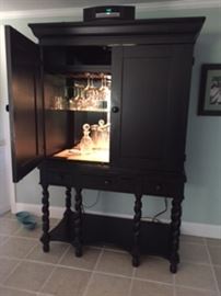 Beautiful Bar  Hang stem ware and store bottles mirrored and lit