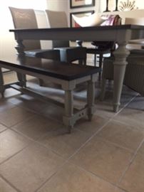 60x 60 table sits 8 or without leaf 40x60 sits 6. 4 painted grey wicker chairs 2 Louis Phillip wood side chairs and lovely bench sits up to 3. Oak top.