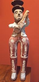 Terra cotta figurine is Peruvian, c. 1950. 
