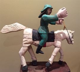 The man on horseback is Santiago Matamoros, Saint James the Moor-slayer, the patron saint of Spain who is a popular figure in Spanish and Latin-American art. 