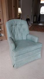 SWIVEL BLUE UPHOLSTERED CHAIR.