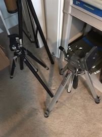Two of four camera tripods