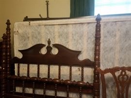 wooden bedpost with mattress and bed springs