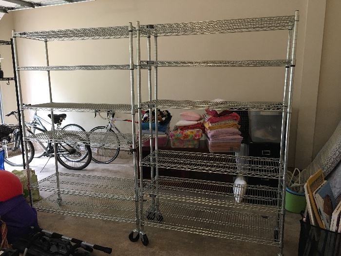 2 metal shelving systems with casters
