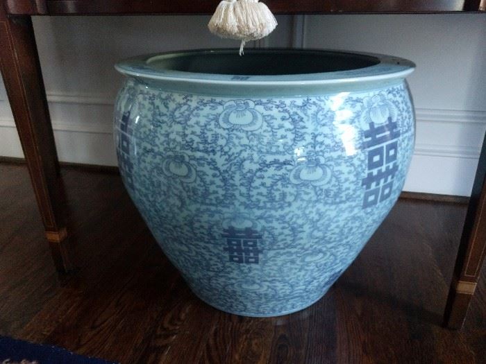 BIG ol' blue/white Asian fishbowl, the kind you can rub to make a genie pop out.
How you rub the genie once he appears is up to you.