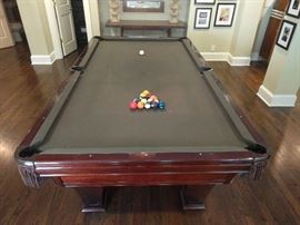 9' "Ventura" pool table, by Brunswick.                    Outside dimension 60" x 110", Playing area 50" x 100", Shipping weight, 927 pounds.                               Features include: traditional regulation size leather net pockets, 3-piece precision ground 1" full size slate, solid mahogany rails with pearlized inlaid sights. 