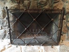 Quite substantial wrought iron fire screen. Please remove before baking cookies for Santa.                      He doesn't like boundaries when he pops in for a quickie.